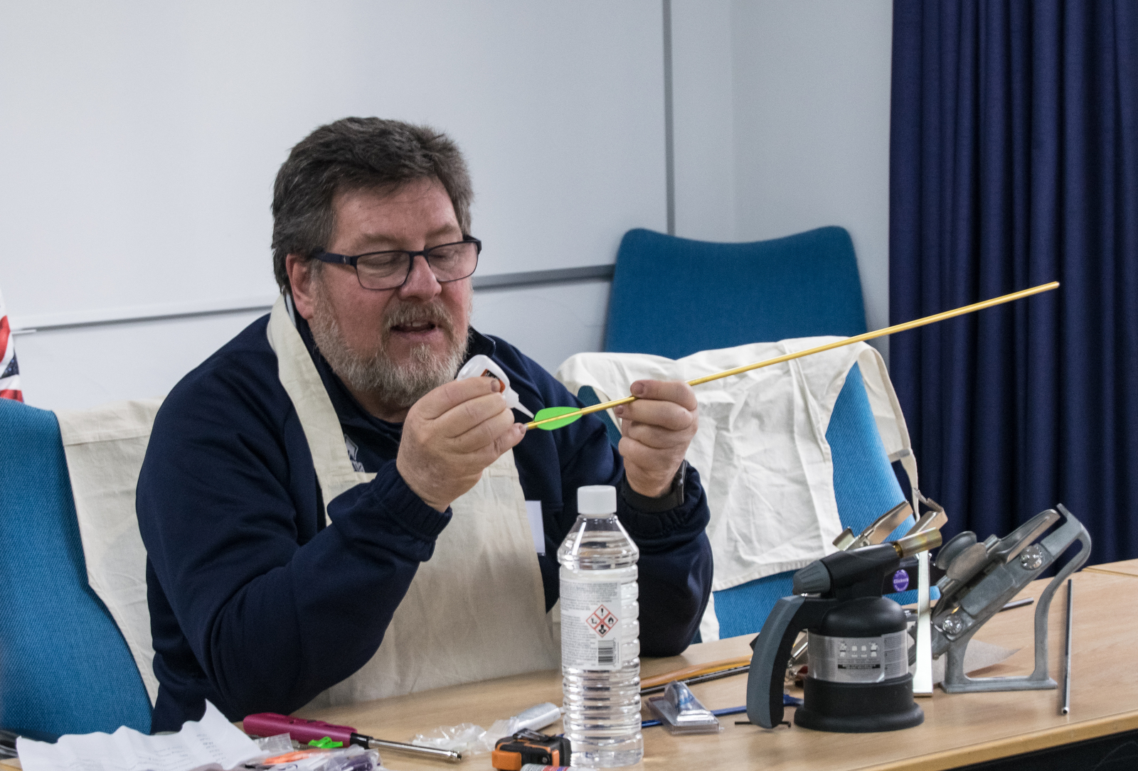 Tutor teaching arrow maintenance